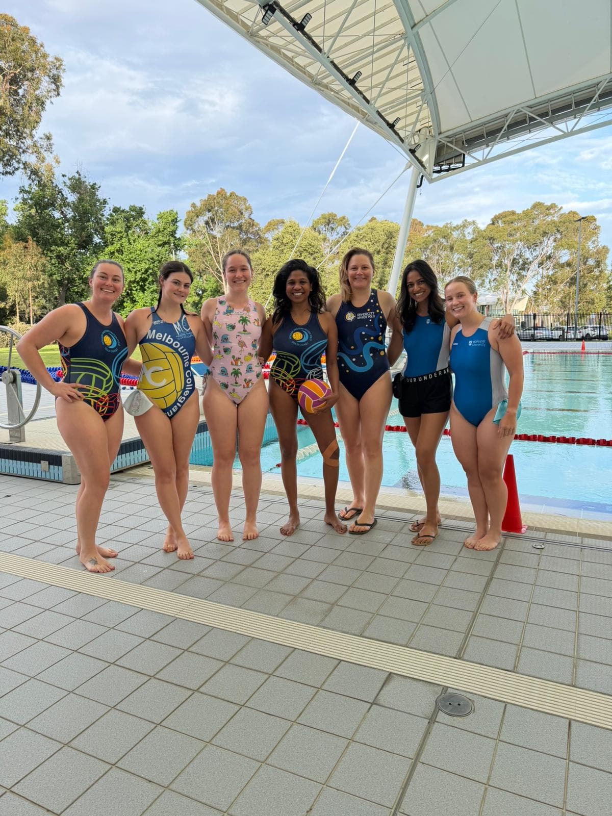 Water polo players poolside